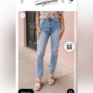 Women’s light wash button fly distressed jeans. Size S. NWT.